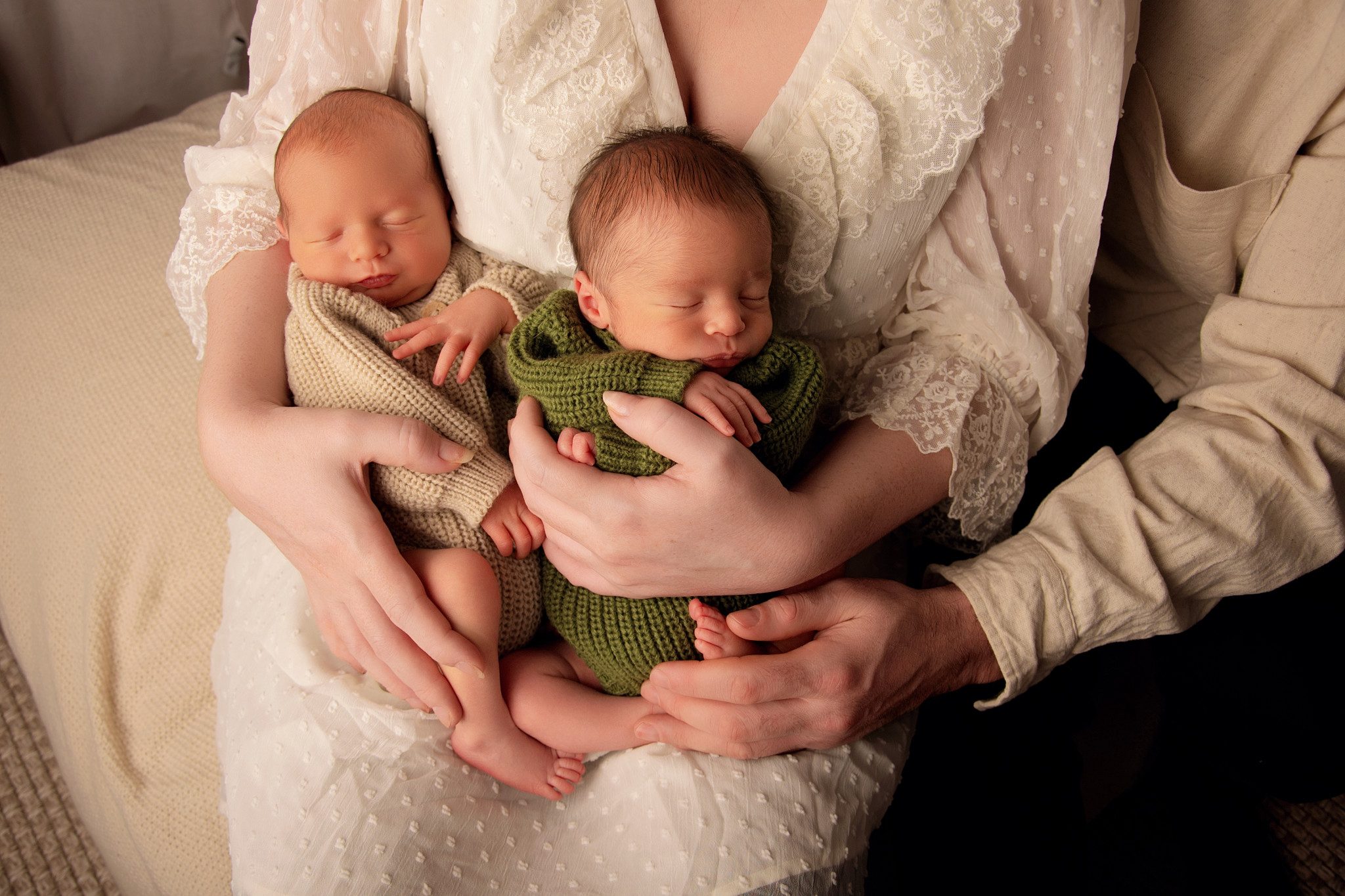 Mother holding a newborn baby in soft warm lighting